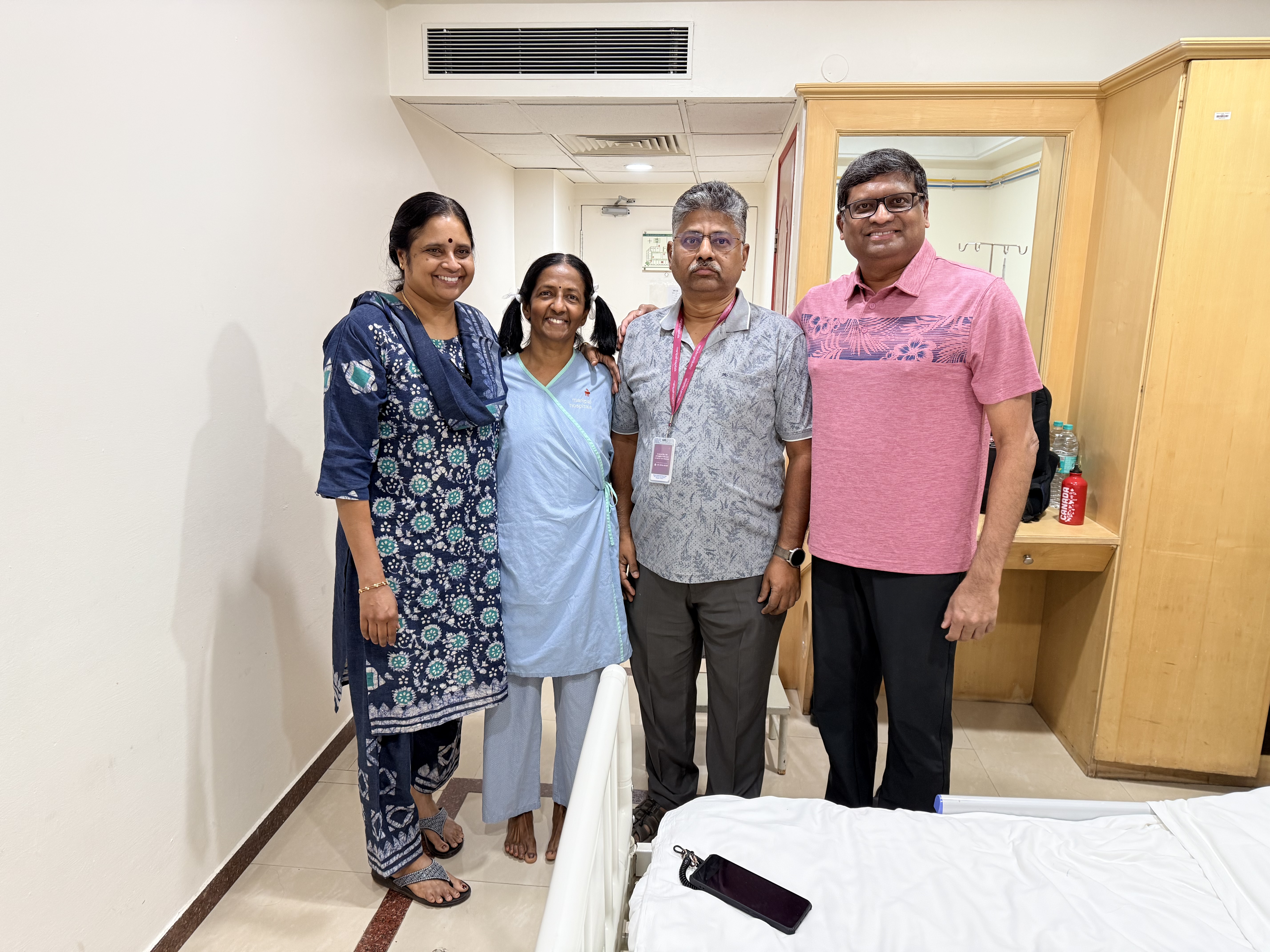 Meena surrounded by family before surgery